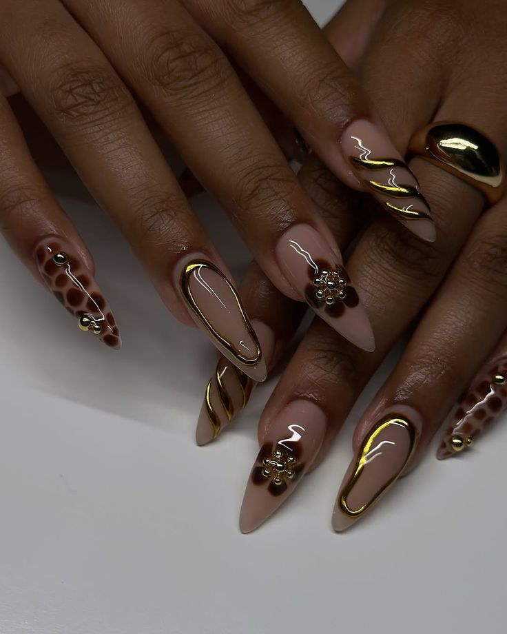 Black French-tip nails with tiny bows, heart details, and crystal accents